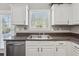 Beautiful kitchen sink with plenty of natural light from the nearby window at 2311 Fall Creek Lndg, Loganville, GA 30052