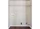 Unfinished laundry area with hookups ready for washer and dryer appliances at 2311 Fall Creek Lndg, Loganville, GA 30052