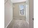 Ample closet space with shelving, natural light, and neutral paint tones at 2311 Fall Creek Lndg, Loganville, GA 30052