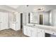 Spacious bathroom featuring double sinks and a large mirror, and multiple entry doors at 2740 Barimore Pl, Dacula, GA 30019
