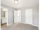 Neutral bedroom with open doorway to bathroom and hallway at 2740 Barimore Pl, Dacula, GA 30019