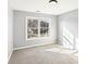 Sun-filled bedroom featuring a window and neutral carpet at 2740 Barimore Pl, Dacula, GA 30019