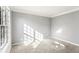 Bright bedroom filled with natural light streaming from a large window at 2740 Barimore Pl, Dacula, GA 30019