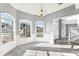 Bright dining room featuring large windows, elegant chandelier, and neutral color palette at 2740 Barimore Pl, Dacula, GA 30019
