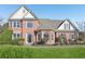 Charming two-story red brick home with manicured lawn and mature landscaping at 2740 Barimore Pl, Dacula, GA 30019
