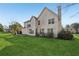 Expansive home exterior with a well-maintained lawn, multiple windows, and a classic chimney at 2740 Barimore Pl, Dacula, GA 30019