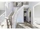Grand foyer with staircase, light gray paint, tile floors, and natural light at 2740 Barimore Pl, Dacula, GA 30019