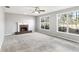 Spacious living room with fireplace and large windows at 2740 Barimore Pl, Dacula, GA 30019