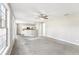 Open-concept living room with ample space, large windows, and view to the kitchen at 2740 Barimore Pl, Dacula, GA 30019