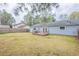 View of the backyard with a small wooden deck and grassy area at 6939 Hickory Log Rd, Austell, GA 30168