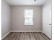 Bedroom showcasing a window with natural light and closet with hard surface flooring at 6939 Hickory Log Rd, Austell, GA 30168