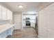 Updated kitchen features white cabinets, modern appliances and convenient breakfast bar at 6939 Hickory Log Rd, Austell, GA 30168