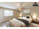 Comfortable staged bedroom with a cozy bed, bedside tables, and natural lighting at 6939 Hickory Log Rd, Austell, GA 30168