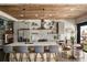 Modern kitchen boasts stainless steel appliances, a spacious island, and stylish wood ceiling at 890 Memorial Se Dr # 101, Atlanta, GA 30316