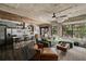 Open-concept living space features a comfortable sofa, exposed ceilings, and large windows at 890 Memorial Se Dr # 101, Atlanta, GA 30316