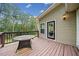 Back deck with outdoor seating, overlooking a private, wooded backyard at 2517 N Hightower Trl, Conyers, GA 30012