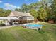 Spacious backyard with manicured lawn, above-ground pool, covered parking, and a shed at 2517 N Hightower Trl, Conyers, GA 30012