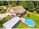 Sprawling backyard featuring a deck, shed, above-ground pool, and green space at 2517 N Hightower Trl, Conyers, GA 30012