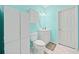 Charming bathroom features a single vanity, a white toilet, and a white cabinet at 2517 N Hightower Trl, Conyers, GA 30012