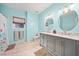 Bathroom features a double vanity, granite countertops, and two round mirrors at 2517 N Hightower Trl, Conyers, GA 30012