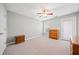 A calming bedroom with gray walls, ceiling fan and plush neutral carpeting at 2517 N Hightower Trl, Conyers, GA 30012