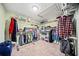 Walk-in closet with ample shelving and rod space for storage at 2517 N Hightower Trl, Conyers, GA 30012
