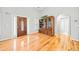Foyer with hardwood floors, decorative wood door, and built-in shelving at 2517 N Hightower Trl, Conyers, GA 30012
