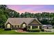 Inviting single-story home with stone accents, manicured lawn, and attached garage at 2517 N Hightower Trl, Conyers, GA 30012