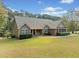 Beautiful single-story home with lush lawn and landscaped front yard at 2517 N Hightower Trl, Conyers, GA 30012
