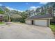 Detached garage with covered parking and large concrete driveway at 2517 N Hightower Trl, Conyers, GA 30012