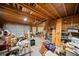 Unfinished garage space with fluorescent lighting, ladder access, and workbench at 2517 N Hightower Trl, Conyers, GA 30012