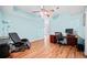 Inviting office with hardwood floors and a ceiling fan for added comfort at 2517 N Hightower Trl, Conyers, GA 30012