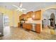 Open kitchen features wooden cabinetry and stainless steel appliances at 2517 N Hightower Trl, Conyers, GA 30012