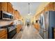 Bright kitchen featuring stainless steel appliances and view to a casual dining area at 2517 N Hightower Trl, Conyers, GA 30012