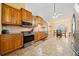 Kitchen featuring stainless steel appliances, wooden cabinetry, and view to dining area at 2517 N Hightower Trl, Conyers, GA 30012