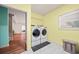 Well-lit laundry room equipped with modern washer and dryer at 2517 N Hightower Trl, Conyers, GA 30012