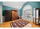 Bright living room features a large window and decorative rug at 2517 N Hightower Trl, Conyers, GA 30012