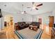 Bright and spacious living room featuring hardwood floors and comfortable leather sofas at 2517 N Hightower Trl, Conyers, GA 30012