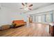 Spacious living room featuring hardwood floors and a ceiling fan for added comfort at 2517 N Hightower Trl, Conyers, GA 30012