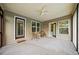 Covered screened porch with carpet, ceiling fan, windows and a door to the yard at 2517 N Hightower Trl, Conyers, GA 30012