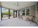Carpeted screened porch with windows, and view to the deck and backyard at 2517 N Hightower Trl, Conyers, GA 30012