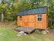 New wood shed with deck, double doors and windows for storage or workshop at 2517 N Hightower Trl, Conyers, GA 30012