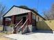 Newly renovated exterior with modern siding, covered porch and gray stone accents at 624 S Grand Nw Ave, Atlanta, GA 30318