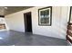 Spacious porch with a tiled floor, wood railing and siding at 624 S Grand Nw Ave, Atlanta, GA 30318
