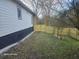 Side yard view with freshly stained wood fence along property line at 624 S Grand Nw Ave, Atlanta, GA 30318