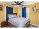 Well-lit bedroom featuring a comfortable bed, a wall-mounted TV, and abundant natural light for a cozy feel at 660 Simmons St, Atlanta, GA 30318