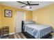 Bedroom features a ceiling fan, a storage shelf, and a comfortable bed at 660 Simmons St, Atlanta, GA 30318