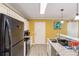 The kitchen features a breakfast bar with granite countertops, stainless steel appliances, and white cabinets at 660 Simmons St, Atlanta, GA 30318
