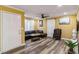 A cozy living room is showcased, with hardwood style floors, a comfortable leather couch, and a ceiling fan at 660 Simmons St, Atlanta, GA 30318