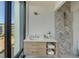 Well-lit bathroom features a modern vanity, stylish mirror, and a large window for natural light and views at 816 Berne St # 3, Atlanta, GA 30316